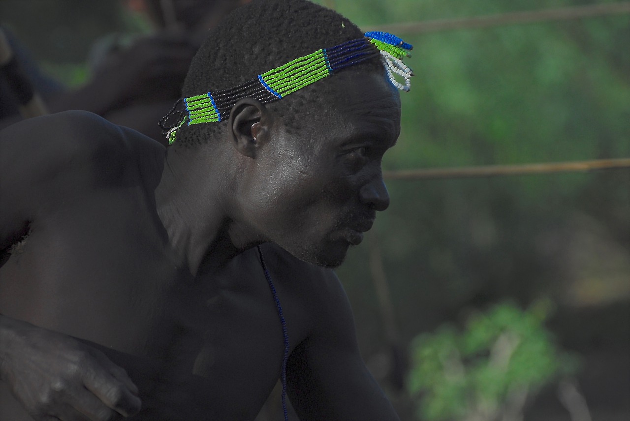 Hadzabe hunter with bow and arrow in Lake Eyasi bush